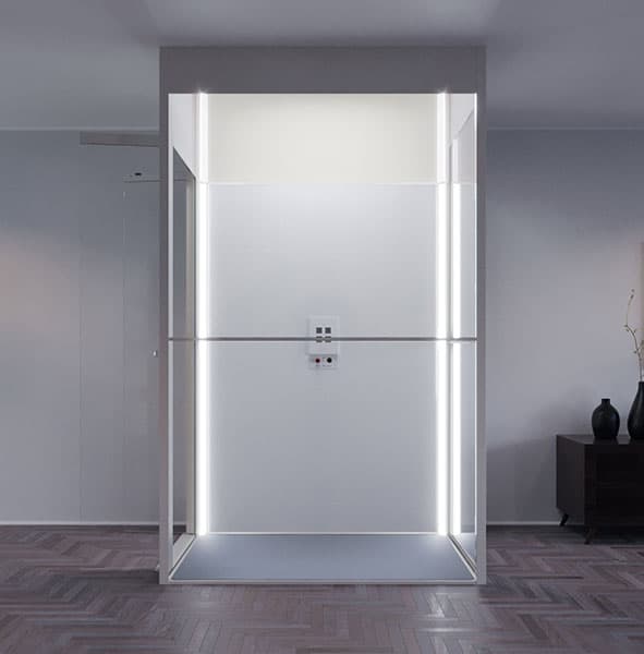Swift Lite in white with lit corner profiles, standing on herringbone parquet in a grey living room