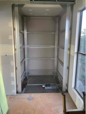 The re-assembled lift shaft standing in position inside a house