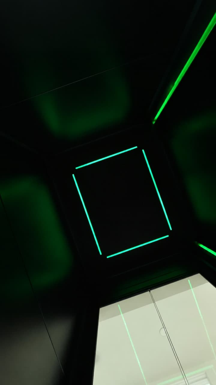 Green RGB LED ceiling strips inside a Jet Black Swift Pro XL cabin in a Broadbeach penthouse on the Gold Coast