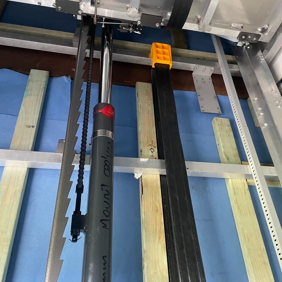 Phoenix lift shaft install at Mt Coolum Golf Course, hydraulic cylinder handwritten Mount Coolum, safety rail and framing still open