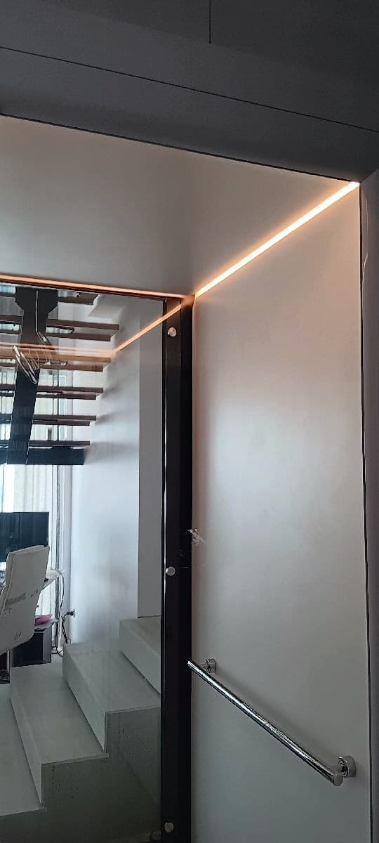 Phoenix home lift cabin with LED ceiling strip and chrome handrail in a Sunrise Beach home, Sunshine Coast
