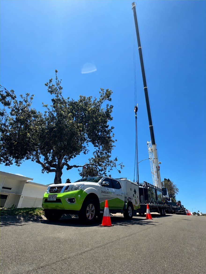A Phoenix home lift in a beachfront Sunrise Beach home on the Sunshine Coast, with an Aussie Lifts ute and crane on the street during the install