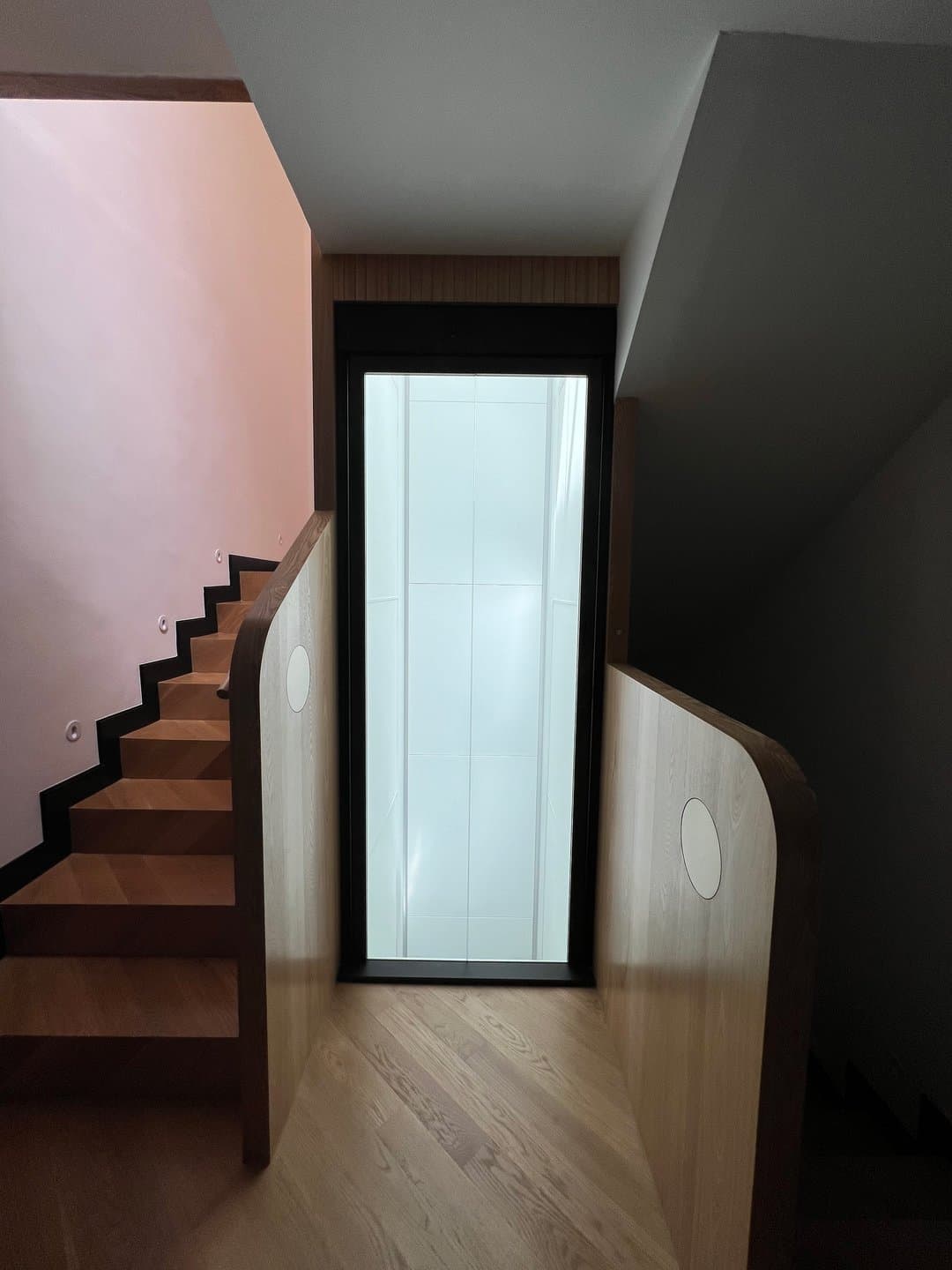 Swift Lite with a black door frame, set into a timber stairwell