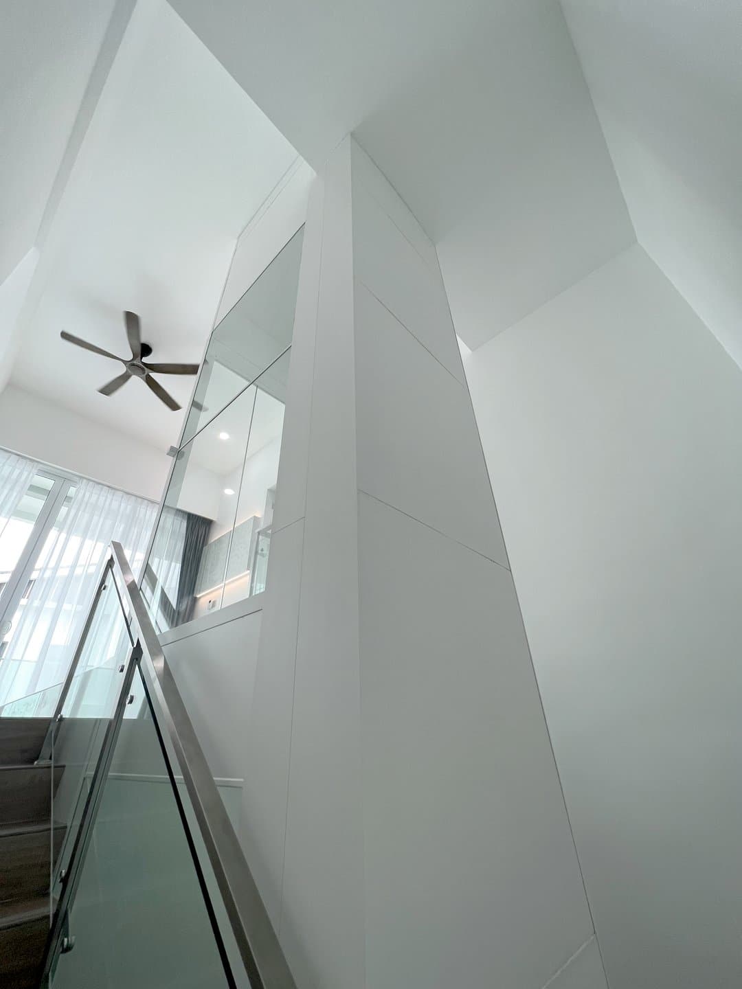 Swift Lite white shaft rising through a double height stairwell void