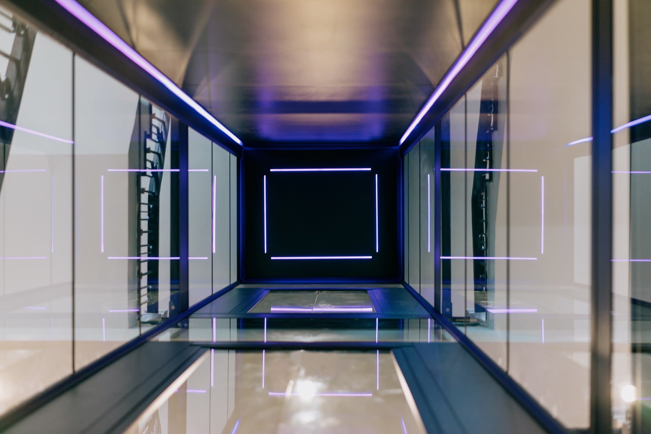Swift Pro cabin and shaft lit in purple, seen through the glass from below